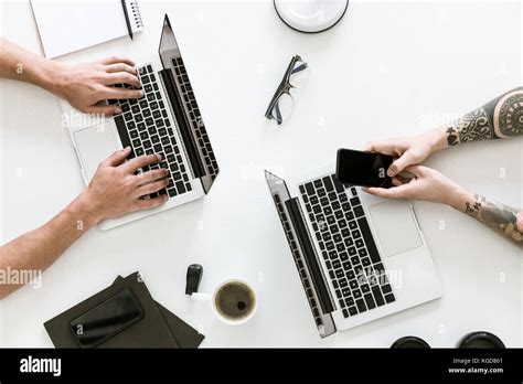 Two Men Working With Laptops Stock Photo Alamy