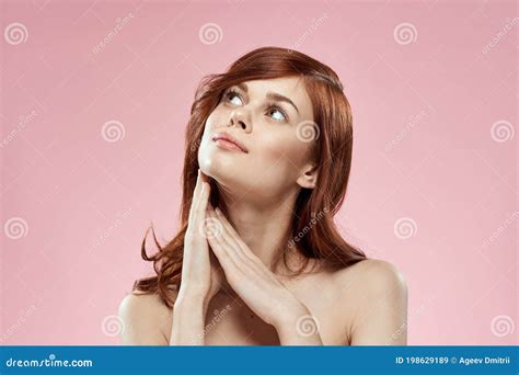 Pretty Woman With Long Beautiful Hair Grooming Hairstyle Glamor Naked Shoulders Pink Background