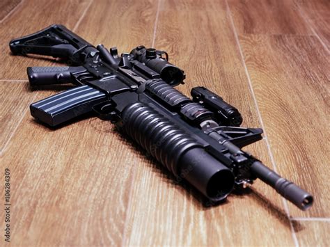 Ar Rifle With Grenade Launcher On The Wooden Floor Adobe Stock