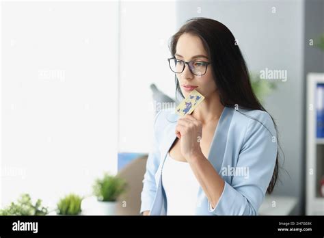 Brunette Charming Woman Think How To Spend Money On Credit Card Stock Photo Alamy