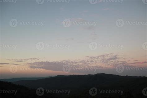 sunrise sunset sky with clouds over the mountain view background ...