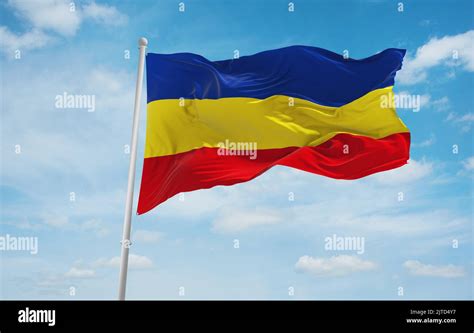 flag of Austroasiatic peoples Khmer Krom at cloudy sky background, panoramic view.flag ...