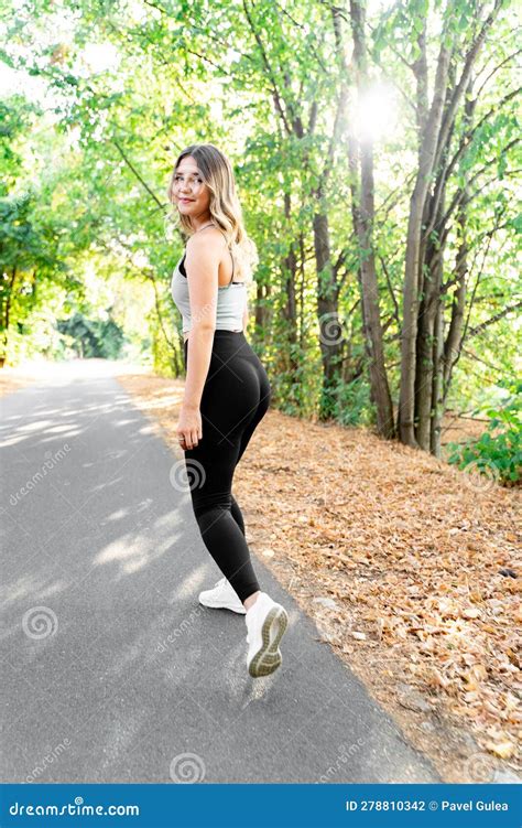 Caucasian Woman In Fitness Clothes Looked Back Into Camera While