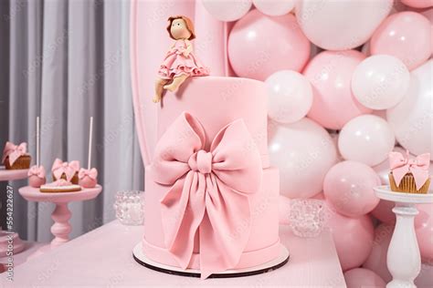 Pink birthday cake for a little girl with a sugar doll. Pink style ...