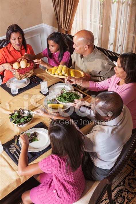 Multi-Generation African American Family At Dinner Table Stock Photo
