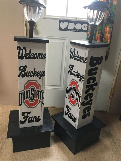 Two Black And White Signs With The Words Welcome Buckeye And