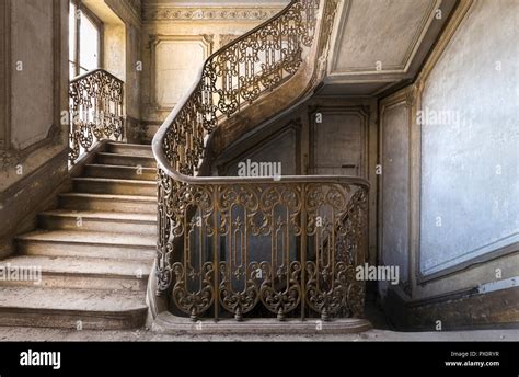 Interior view with a staircase in an abandoned castle in France Stock ...