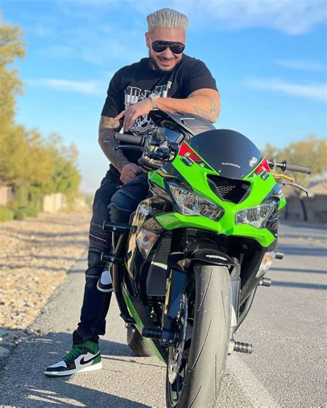 DJ Pauly D Shows Off Blond Hair While Posing on Motorcycle