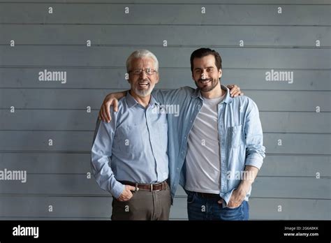 Happy Mature Senior S Father And Grown Son Standing Together Stock Photo Alamy