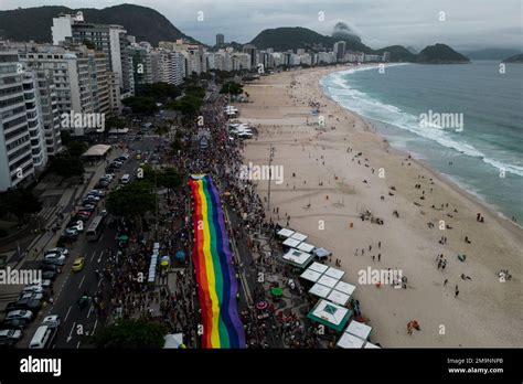 People Carry A Giant Rainbow Flag During The Th Gay Pride Parade Along Copacabana Beach In Rio