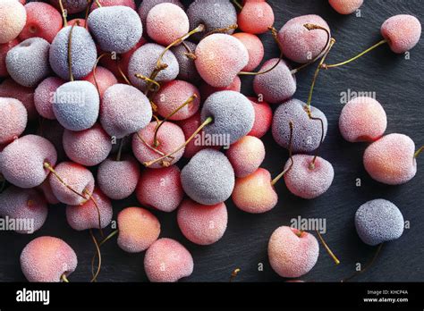 Frozen Cherry On Black Slate Close Up Top View High Resolution