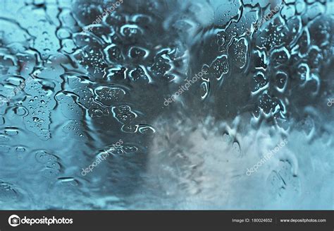 Rain falling on a window pane — Stock Photo © KajaNi #180024652