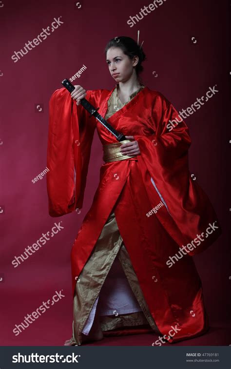 Beautiful Brunette Girl In A Japanese Kimono With Katana Stock Photo