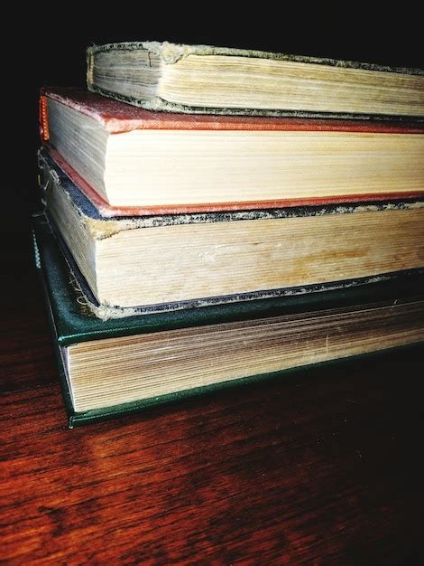 Premium Photo Stacked Books On Table