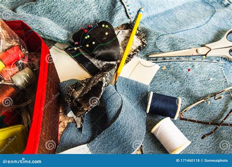 Set Of Tailoring Tools Accessories And Fabric On Table Stock Photo