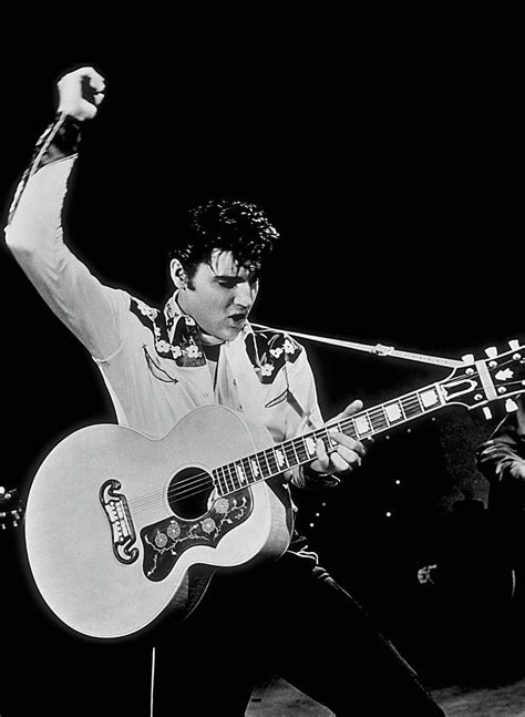 Elvis Presley Playing Guitar On Stage Photograph By Globe Photos Pixels