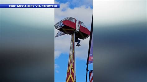 Carnival worker hangs 30 feet in air while protecting girl during ride mishap at the Groves ...