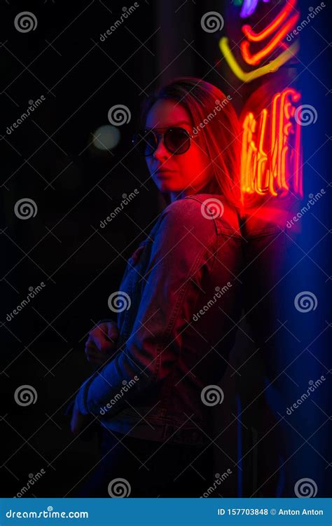 Creative Sexual Portrait Of A Girl In Neon Lighting With Glasses Night