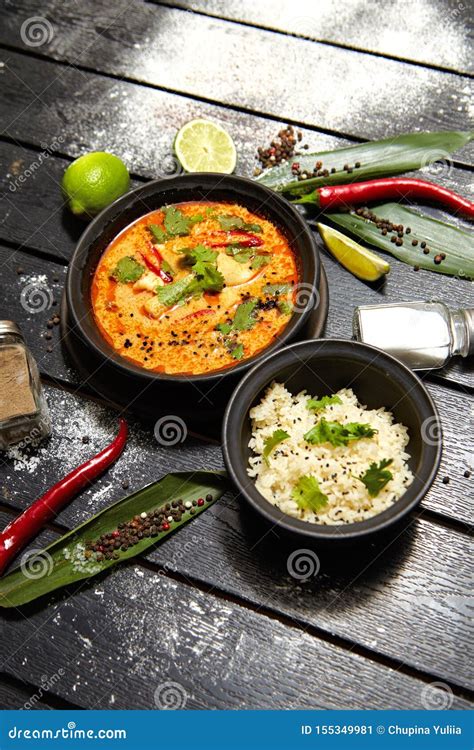 Asian Dish On A Black Plate Tom Yum With Rice Stock Image Image Of