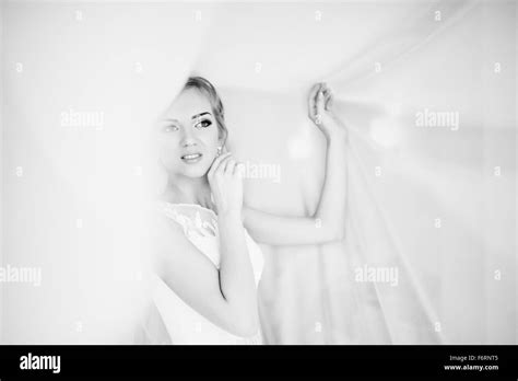 Gentle Blonde Bride On Curtains Tender Posed Stock Photo Alamy