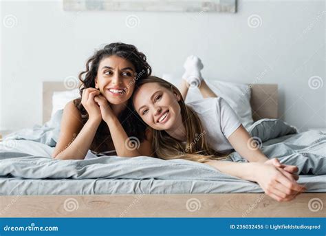 Smiling Lesbian Couple Lying On Bed Stock Photo Image Of Relax Caucasian 236032456