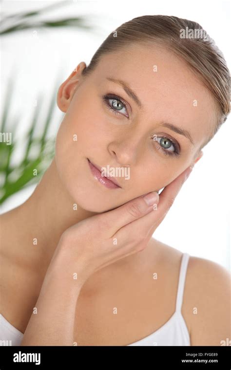 Portrait Of Graceful Blonde Stroking Her Face Stock Photo Alamy