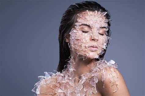 Premium Photo Close Up Of Woman With Broken Glass On Body Against Purple Background