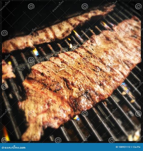 Skirt steak on grill stock photo. Image of detail, grilled - 108951112