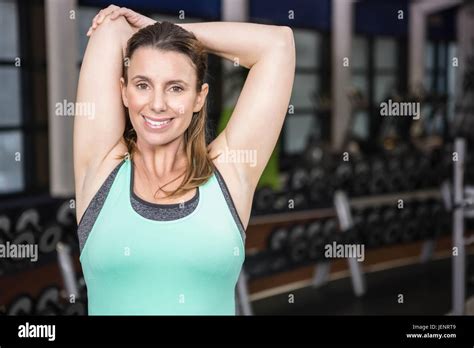 Smiling Brunette Stretching Her Arms Stock Photo Alamy