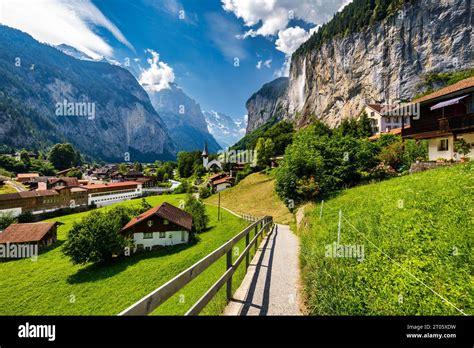 Amazing summer landscape of touristic alpine village Lauterbrunnen with ...