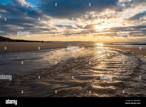 Amazing Colorful Sunset On A Sandy Beach At The Sea Under A Sky Painted