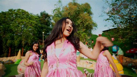 Joyful Young Women In Pink Dresses Dancing In A Sunny Park Setting 44308894 Stock Video At Vecteezy