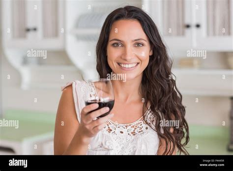Pretty Brunette Having A Glass Of Wine Stock Photo Alamy