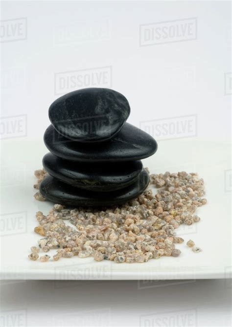 Stack Of Black Stones On Gravel Stock Photo Dissolve