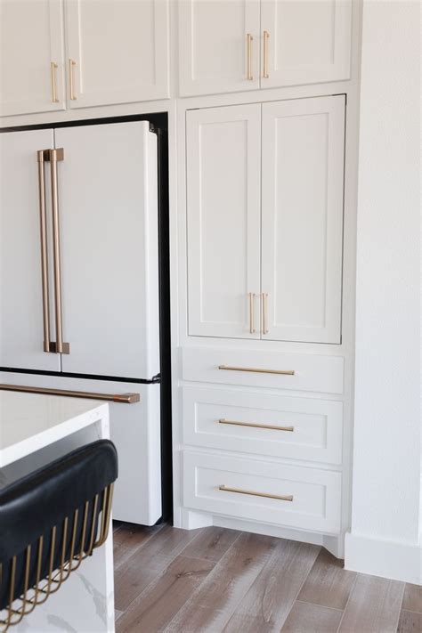 Classic Elegance White Cabinets With Stunning Gold Hardware