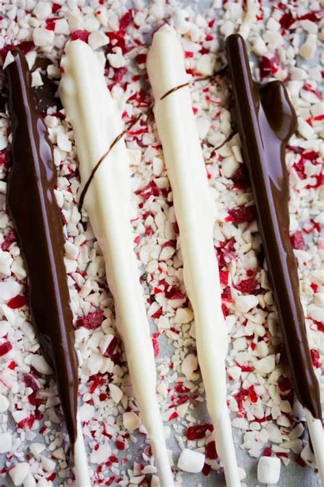 Chocolate Covered Sticks Laying On Crushed Peppermint Christmas Hot