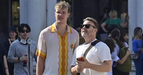 Gary Barlows rarely-seen son, 23, towers over him during getaway after