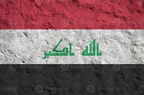 Iraq flag depicted in bright paint colors on old relief plastering wall ...