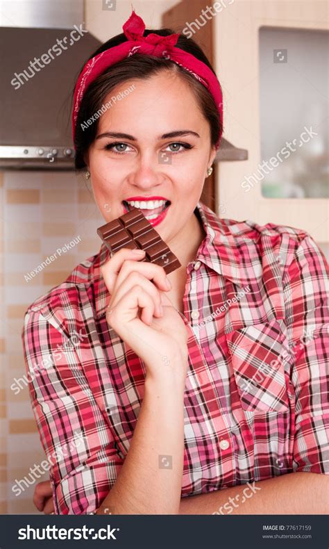 Photo De Stock Sexy Housewife Kerchief Bites Chocolate Bar 77617159