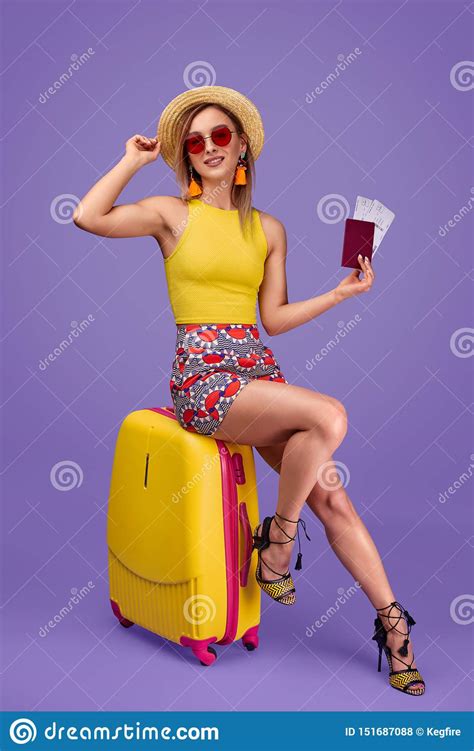 Female Traveler With Tickets Sitting On Suitcase Stock Photo Image Of