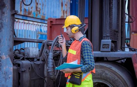 Premium Photo | Portrait team dock workers posing under working and ...