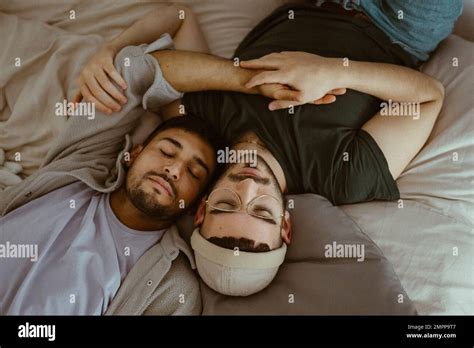 High Angle View Of Gay Couple Sleeping On Bed At Home Stock Photo Alamy