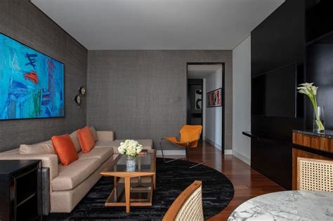 A Living Room Filled With Furniture And A Flat Screen Tv