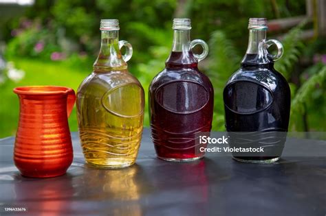 Three Bottles Of Different Types Of Wine On The Table Stock Photo