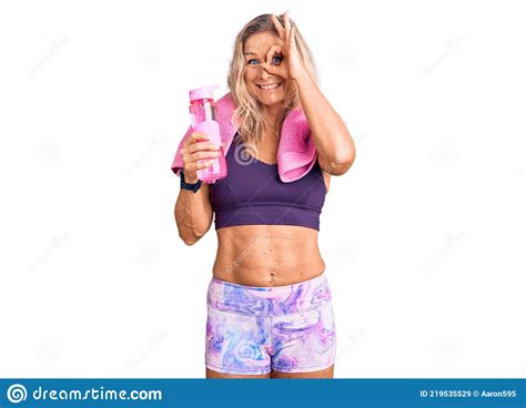 Middle Age Fit Blonde Woman Wearing Sportswear Wearing Towel And