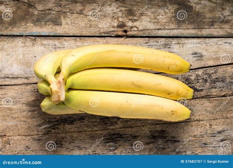 Bunch Of Bananas On Grunge Wood Background Top View Stock Image