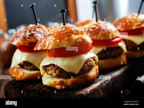 mini hamburgers sliders, mini burgers on board Stock Photo - Alamy