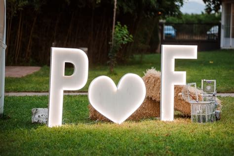 Premium Photo | Wedding decoration of two led letters outdoors.