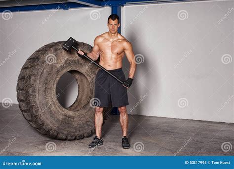 Man With Tire And Hammer Crossfit Stock Image Image Of Muscular