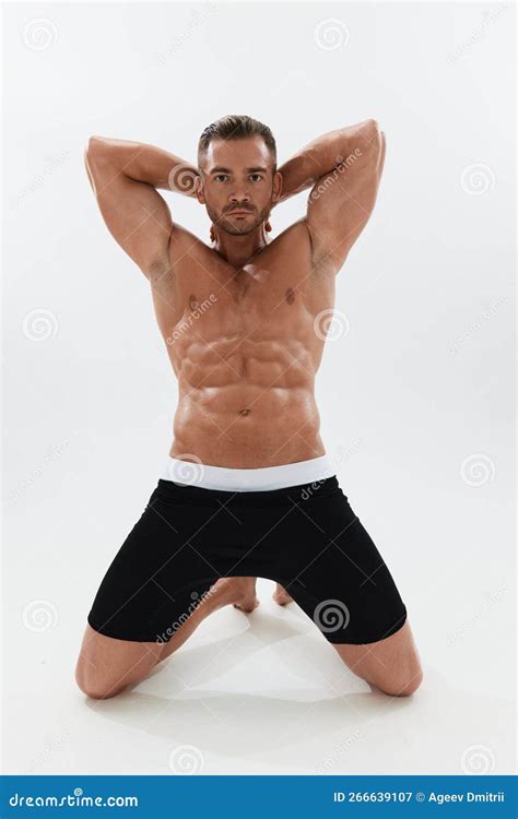 Man Athletic Body Bodybuilder In Briefs With Naked Torso Abs Full Length In The Background